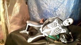 Frogman Is Wrestled And Humps By A Spandex Skeleton In A Fantasy Scene
