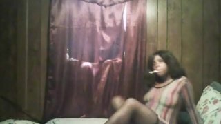 Sexy Black Girl Smoking While Wearing A See-Through Dress