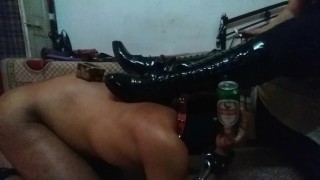 Mistress Makali Makes Use Of A Slave As Both A Foot Stool And A Bottle Holder