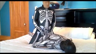 Gassing Black Masked Android In Spandex Skeleton With Stocking Mask