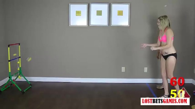 Two beautiful ladies strip while playing toss the balls