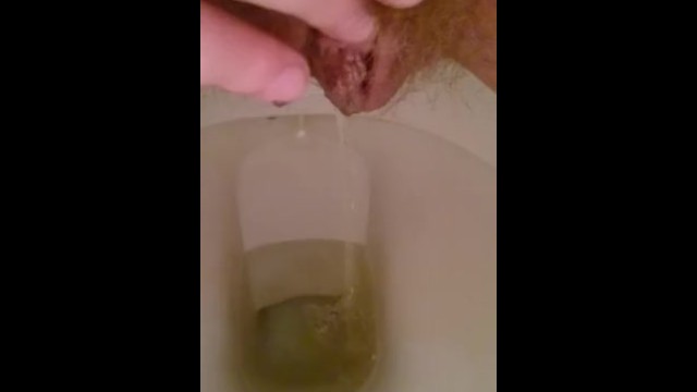 Playing with my hairy pussy while pissing on the toilet 14