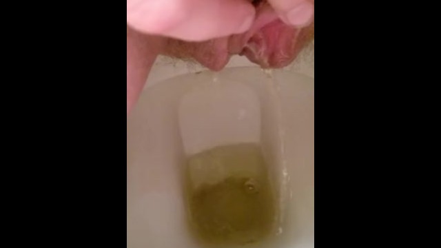 Playing with my hairy pussy while pissing on the toilet 14