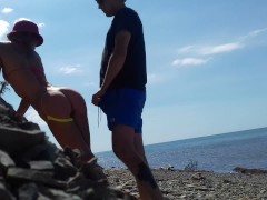 Real amateur doggystyle on the public beach. Outdoors sex.