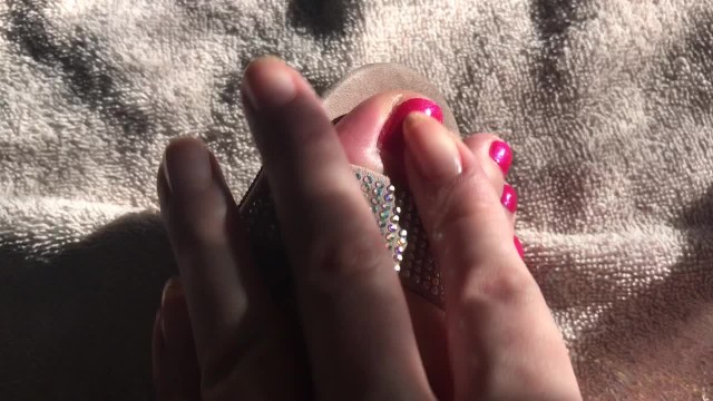 Feet in heels and rubbing on lotion 11