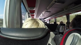 The naked blonde masturbates in a public bus.