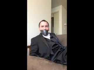 Handcuffed And Tapegagged In A Tuxedo