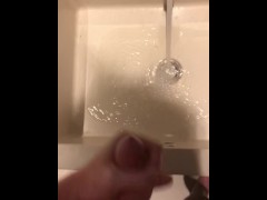 Blasting a load on hotel mirror
