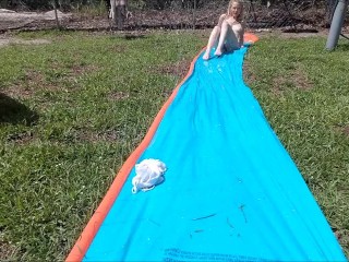 Blonde does Slip n Slide Naked in_her backyard &masturbates