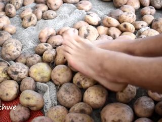 Touching Delicious Potatoes With The Feet