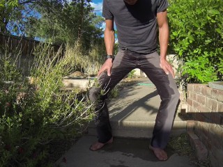 Pissing grey jeans in_a huge flood outdoors