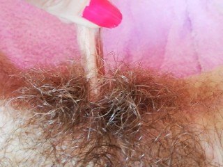 Playing with clit hood pulling and stretching hairy...