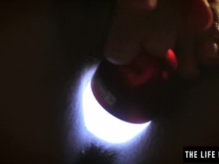 Sleepless girl rubs_her clit at night with a hand held_light