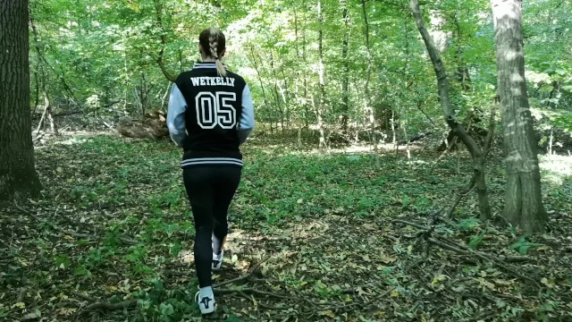 Hot girl peeing in public while walking in the forest. WetKelly 2