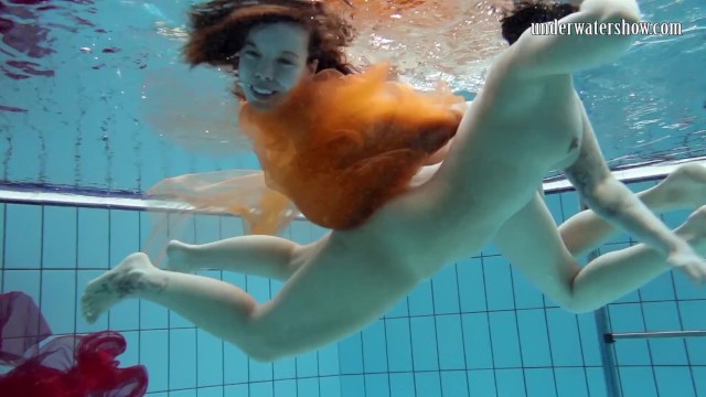 Two hotties submerged underwater