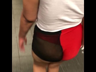 Wife in mesh see through shorts walking around trainstation