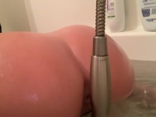 Screen Capture of Video Titled: Bath Masturbation with the Shower Head Quick Intense Orgasm