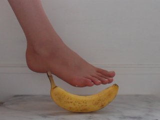 Teen Plays With A Banana With Her Feet