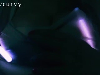 Carlycurvy plays with glow_sticks while rubbing big boobs and clit down