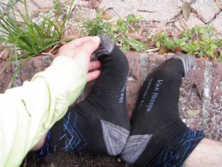 Ftm Transman Rubs Feet Together In Sneakers And Socks