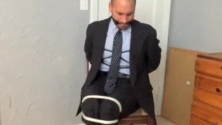 Businessman In A Suit Chairtied