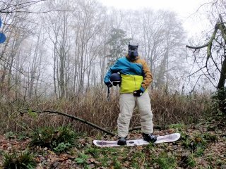 Snowboard Pup Pawing Off Outdoors