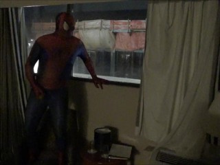 spiderman jerking off watching construction workers from his hotel window