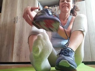 Sweaty Feet After Workout. Stinky Socks_and Sneakers.Sniffing - OlgaNovem