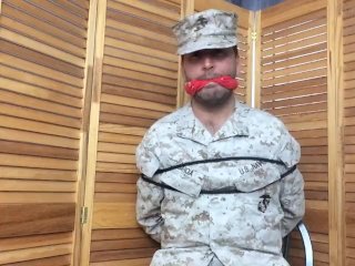 Marine Tied To Chair