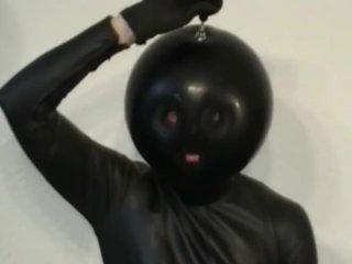 Latex Catsuit Girl With Black Rubber Ballhood Masturbates With Her Pussy