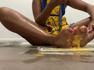 Ebony pink haired ethot massages feet with oil and_then crushes raw_eggs.