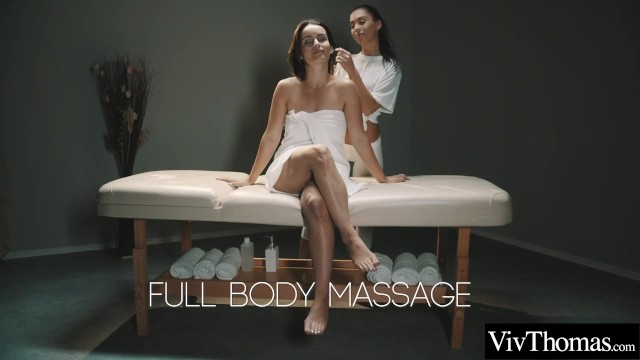 Sexy masseuse gives brunette a naked massage then fingers her tight pussy