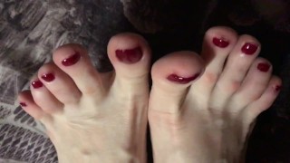 A Close-Up Of Red-Painted Toes