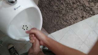 Solo Urinating In A Public Restroom