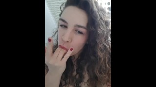 Curly Brunette Squirting Herself With A Low Angle View Of Her Ass And Pussy