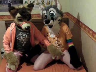 Two Cute Fursuiters Giving Helping Hand To Each Others