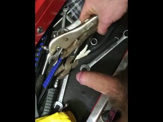 Mechanic Plays With His Tools