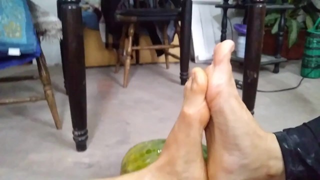Two Amazons barefeet interlock toes and footfight