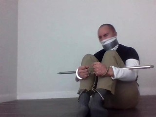 handcuffed tapegagged in a turtleneck