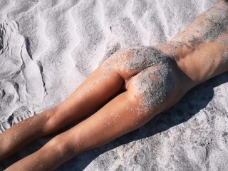 Stranger finds a perfect tanned skinny brunette on a nudist beach and gives her a hot piss 