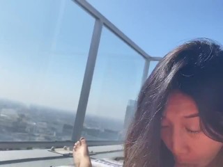 Gorgeous Asian Babe Isla Summer Sucks a Lucky Cock on a Balcony in the Sky