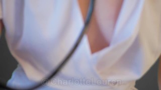 THE NURSES UNIFORM IS WIDE OPEN PROVIDING A GOOD DOWNBLOUSE ENFORCE