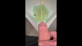 Pissing PISSING IN THE URINAL WITH A SOFT UNCUT COCK