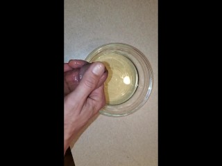 Piss and cum into a bowl. Using piss as lube.