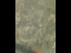 Feet under water at sea in sunny day