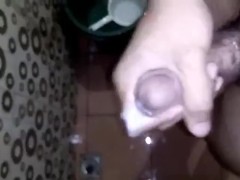 Horny Young Guy Having Fun Jerking Off His Huge Cock in the Toilet