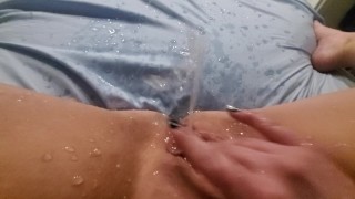 Fingering pussy, huge squirt leaves puddle in amateur bed 