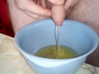 Closeup When John Is Peeing Into A Plastic Bowl