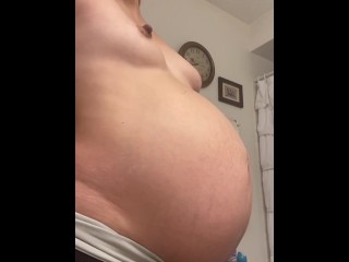 Pregnant milf rubs belly and_then strips