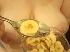 Redhead milf milks sperm onto her banana dessert.